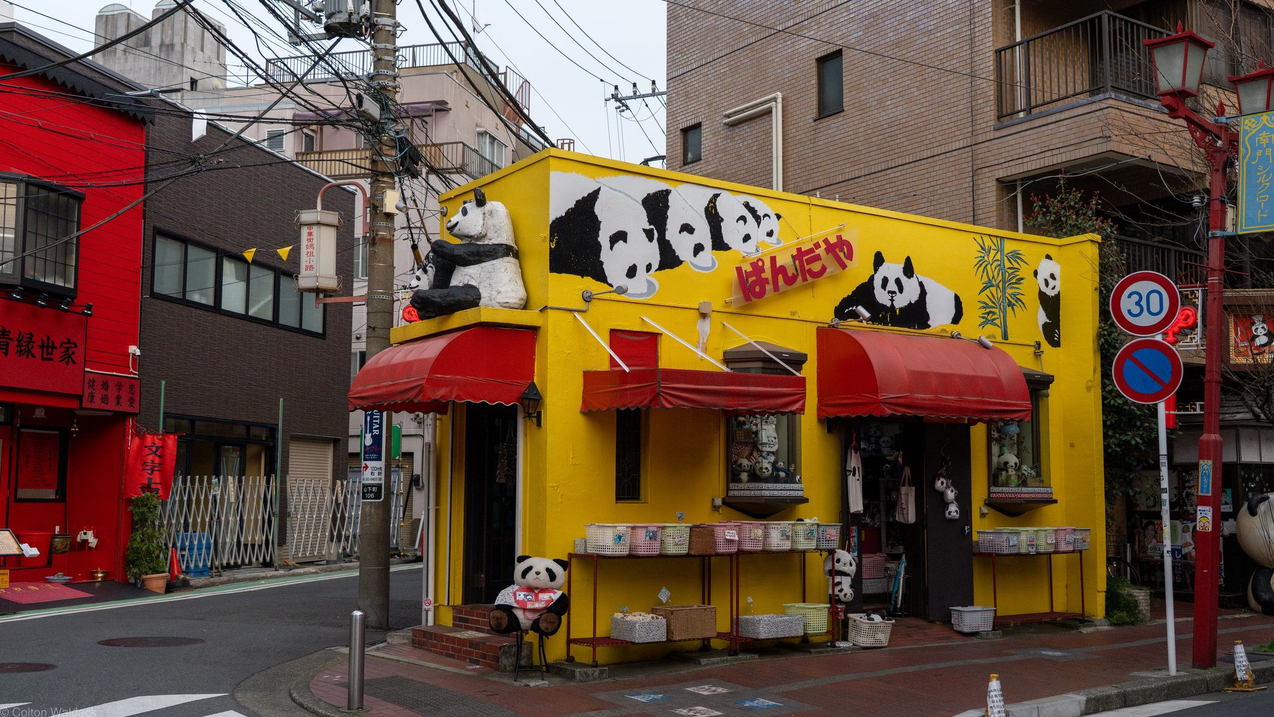 Bright yellow shop covered in painted pandas in Yokohama